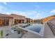 Luxury backyard oasis featuring a rectangular pool and desert landscaping at 8912 W Roberta Ln, Peoria, AZ 85383