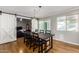 Dining room with a dark wooden table and sliding barn doors at 920 E 10Th Pl, Mesa, AZ 85203