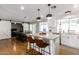 Updated kitchen featuring white shaker cabinets and a granite island at 920 E 10Th Pl, Mesa, AZ 85203