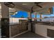 Stainless steel appliances and granite countertops highlight this outdoor kitchen at 920 E 10Th Pl, Mesa, AZ 85203