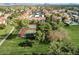 Aerial view showing tennis courts, pool, and community at 9305 E Purdue Ave # 265, Scottsdale, AZ 85258