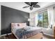 Cozy bedroom with dark accent wall and window seating at 9305 E Purdue Ave # 265, Scottsdale, AZ 85258