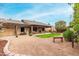 Spacious backyard with covered patio and lawn at 9543 E Palomino Pl, Sun Lakes, AZ 85248