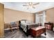 Bedroom with double bed, ceiling fan, and wood storage chest at 9543 E Palomino Pl, Sun Lakes, AZ 85248