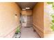 Inviting entryway with tiled flooring, security door, and potted plant at 9543 E Palomino Pl, Sun Lakes, AZ 85248