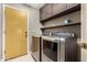 Laundry room with washer and dryer, and built-in shelving at 9543 E Palomino Pl, Sun Lakes, AZ 85248