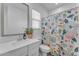 Bathroom with floral shower curtain and white vanity at 9832 E Wavelength Ave, Mesa, AZ 85212