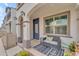 Inviting front porch with seating area and decorative rug at 9832 E Wavelength Ave, Mesa, AZ 85212