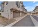 Attached garage and driveway, leading to a community of townhomes at 9832 E Wavelength Ave, Mesa, AZ 85212