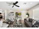 Bright living room featuring hardwood floors and modern furniture at 10006 W Sandstone Dr, Sun City, AZ 85351