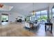 Bright dining room with hardwood floors and a modern chandelier at 11124 E Del Timbre Dr, Scottsdale, AZ 85259