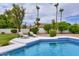 Relaxing poolside view with lounge chairs at 11124 E Del Timbre Dr, Scottsdale, AZ 85259