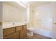 Clean bathroom with a shower/tub combo and wood vanity at 11517 W Coral Snake Ct, Surprise, AZ 85378
