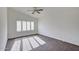 Bright bedroom with plantation shutters and ceiling fan at 11517 W Coral Snake Ct, Surprise, AZ 85378