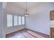 Bright dining area with hardwood floors and window shutters at 11517 W Coral Snake Ct, Surprise, AZ 85378