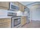 Kitchen with stainless steel appliances including a range, microwave, and refrigerator at 11517 W Coral Snake Ct, Surprise, AZ 85378