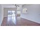 Spacious living area with hardwood floors and access to backyard at 11517 W Coral Snake Ct, Surprise, AZ 85378
