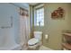 Clean bathroom with shower/tub combo and window at 12526 W Skyview Dr, Sun City West, AZ 85375