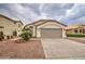 Single story house exterior with a neutral color scheme and landscaped yard at 12533 W Windsor Ave, Avondale, AZ 85323