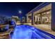 Relaxing pool and patio area at night with a fountain at 13455 W Miner Trl, Peoria, AZ 85383