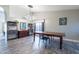 Elegant dining room with a large wooden table and modern chandelier at 1374 S Silverado St, Gilbert, AZ 85296