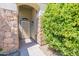 Inviting entryway with a stone facade and decorative iron door at 1374 S Silverado St, Gilbert, AZ 85296