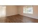 Living room with wood-look flooring and neutral walls at 1403 N Salida Del Sol --, Chandler, AZ 85224