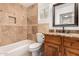 Updated bathroom with granite countertop and tiled tub surround at 15425 N 63Rd St, Scottsdale, AZ 85254