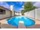 Large kidney shaped pool with diving board at 15425 N 63Rd St, Scottsdale, AZ 85254