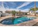 Large kidney-shaped pool with a spacious patio and plenty of room for sunbathing at 15841 N 23Rd Pl, Phoenix, AZ 85022