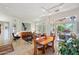 Bright living room with dining area and access to a patio at 16013 W Sentinel Dr, Sun City West, AZ 85375