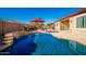 Relaxing kidney-shaped pool with waterfall feature at 16581 W Washington St, Goodyear, AZ 85338