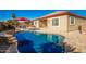 Inviting kidney-shaped pool with patio furniture at 16581 W Washington St, Goodyear, AZ 85338