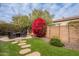 Landscaped backyard with fire pit and stepping stones at 1684 E Elysian Pass, Queen Creek, AZ 85140