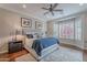 Bright bedroom with bay window, ceiling fan, and hardwood floors at 1684 E Elysian Pass, Queen Creek, AZ 85140