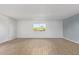 Living room with wood-look floors and window at 17042 E Calle Del Oro -- # D, Fountain Hills, AZ 85268