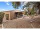 Covered patio overlooks a gravel backyard with desert landscaping at 181 Leisure World --, Mesa, AZ 85206