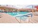 Refreshing community pool with swim lanes and patio chairs at 181 Leisure World --, Mesa, AZ 85206