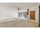 Carpeted living room with a ceiling fan, neutral walls, and natural light at 1922 W Joan De Arc Ave, Phoenix, AZ 85029