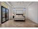 Bright bedroom with a canopy bed and french doors at 20177 E Via De Arboles --, Queen Creek, AZ 85142