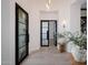 Bright entryway with modern glass doors and light wood floors at 20177 E Via De Arboles --, Queen Creek, AZ 85142