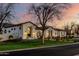 Lovely home with a well-manicured lawn and warm lighting, creating a welcoming ambiance at 20177 E Via De Arboles --, Queen Creek, AZ 85142