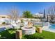 Inviting fire pit with comfortable seating in a landscaped backyard at 20177 E Via De Arboles --, Queen Creek, AZ 85142