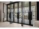 Modern black framed French doors open to a backyard patio at 20177 E Via De Arboles --, Queen Creek, AZ 85142