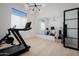 Modern home gym with a treadmill, stationary bike and large mirror at 20177 E Via De Arboles --, Queen Creek, AZ 85142