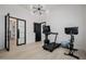 Well-equipped home gym featuring cardio machines and a mirrored wall at 20177 E Via De Arboles --, Queen Creek, AZ 85142