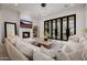 Spacious living room with fireplace and large windows offering natural light at 20177 E Via De Arboles --, Queen Creek, AZ 85142