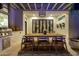 Covered patio with dining table, chairs, grill, and view into the house at 20177 E Via De Arboles --, Queen Creek, AZ 85142