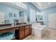 Elegant bathroom with soaking tub, double vanity and large mirror at 2033 W Steed Rdg, Phoenix, AZ 85085