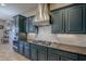 Modern kitchen with stainless steel appliances and dark blue cabinetry at 2033 W Steed Rdg, Phoenix, AZ 85085